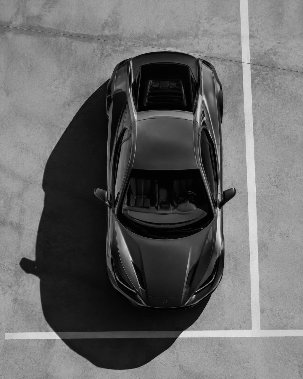 Top-down black and white photo of a sports car